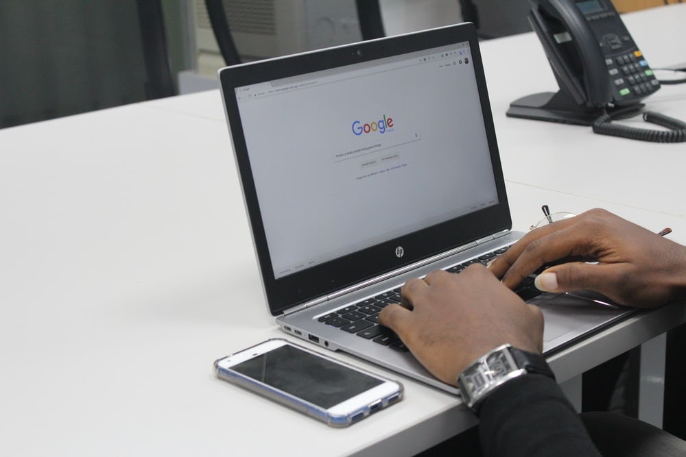 A Landlord using a laptop to promote their rental properties.