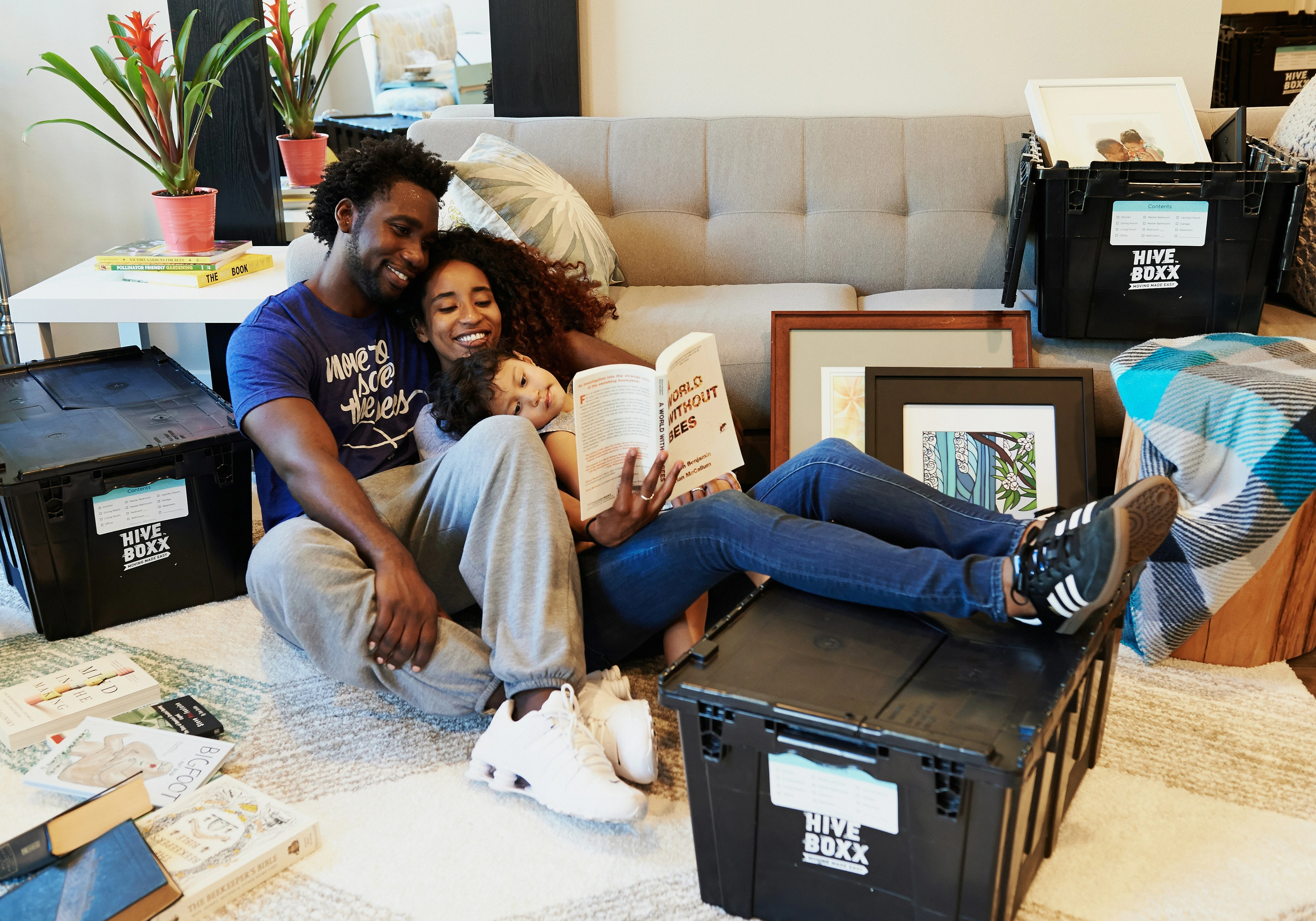 Family relaxing among moving boxes